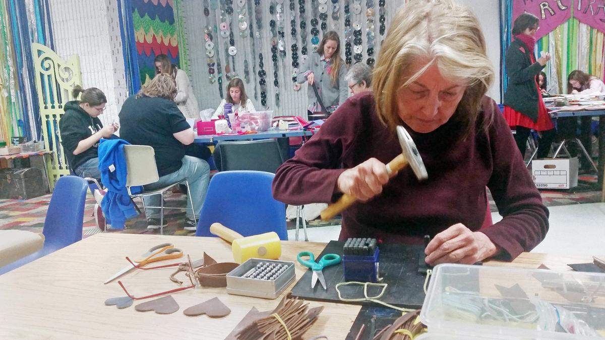 Inez Van Arsdall works to create a leather bookmark at The Scrap Exchange in Durham in 2017. The Scrap Exchange is one of the places in the Triangle for people to buy craft supplies and take classes.