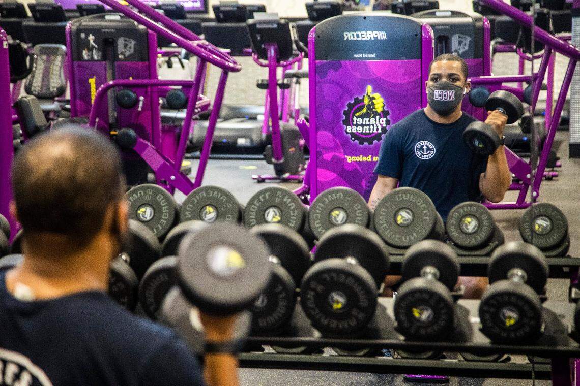 Tyre Basden, 24, works out at a Planet Fitness gym in North Raleigh. Planet Fitness is reopening some gyms in North Carolina this week, despite a coronavirus executive order that keeps gyms closed.