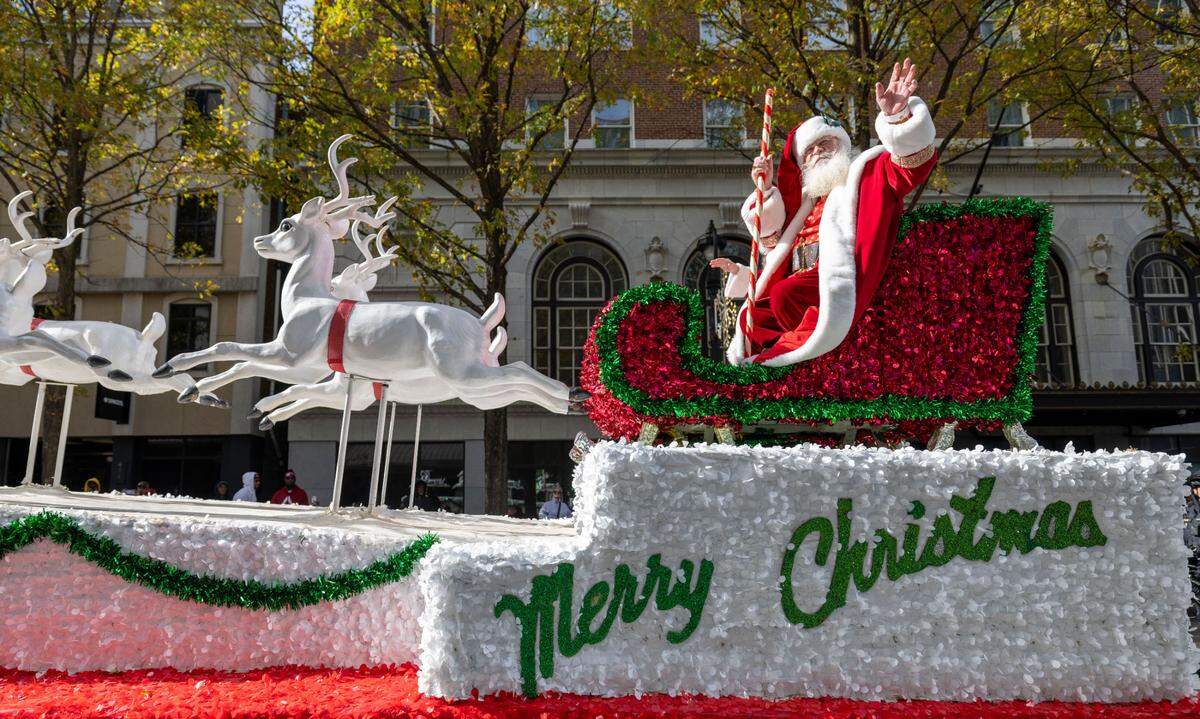 Santa Claus makes his way down Fayetteville Street during the 80th annual Raleigh Christmas Parade on Saturday, November 23, 2024 in Raleigh, N.C.