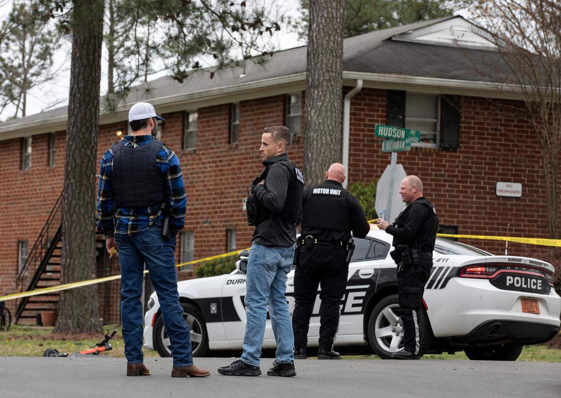 Law enforcement investigate a homicide near the intersection of Hudson Avenue and North Buchanan Boulevard on Wednesday, March 22, 2023, in Durham, N.C.