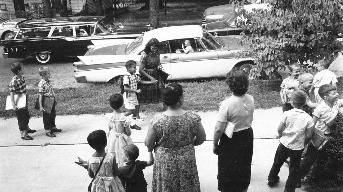 June Campbell walks with her son, William Campbell to school in September of 1960. William Campbell was the first black student to integrate Raleigh, N.C. schools. He later became mayor of Atlanta.