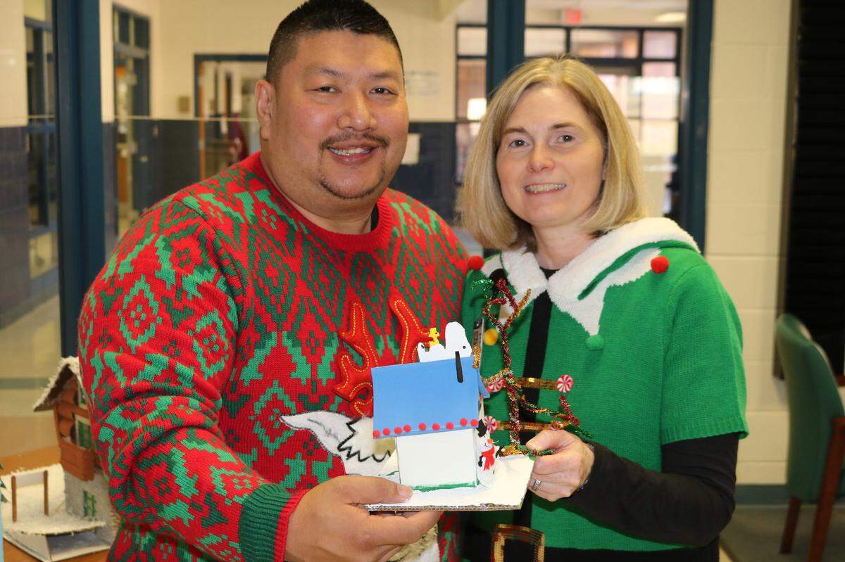 Officer Bud with Emily Dunn, assistant principal at East Montgomery Middle School, during the school’s Christmas sweater day. Officer Bud worked as a school resource officer at East Montgomery Middle.