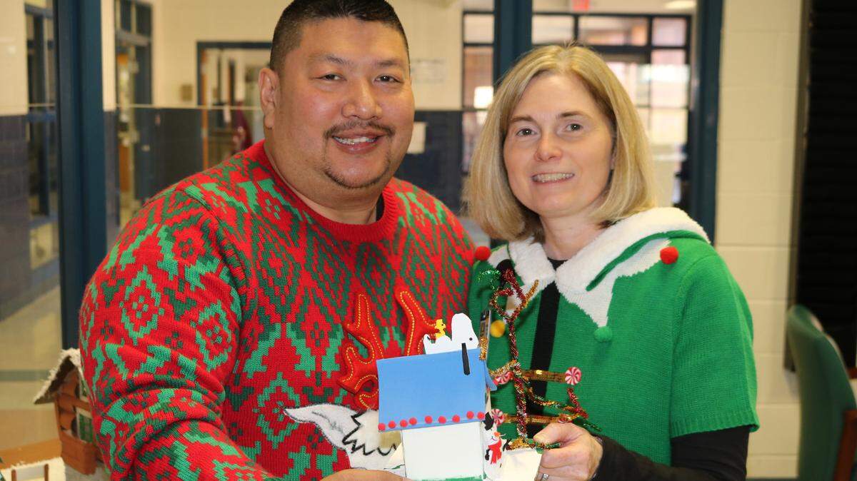 Officer Bud with Emily Dunn, assistant principal at East Montgomery Middle School, during the school’s Christmas sweater day last December. Officer Bud worked as a school resource officer at East Montgomery Middle.