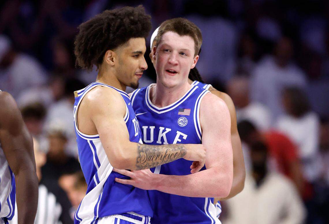 Duke’s Tyrese Proctor (5) congratulates Kon Knueppel (7) after he drilled a three-pointer during the second half of Duke’s 69-55 victory over Arizona at the McKale Memorial Center in Tucson, Ariz., Friday, Nov. 22, 2024.