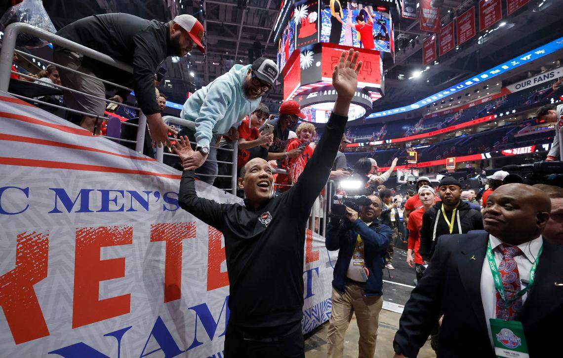 N.C. State head coach Kevin Keatts acknowledges the crowd as he heads off the floor after N.C. State’s 84-76 victory over UNC in the championship game of the 2024 ACC Men’s Basketball Tournament at Capital One Arena in Washington, D.C., Saturday, March 16, 2024.