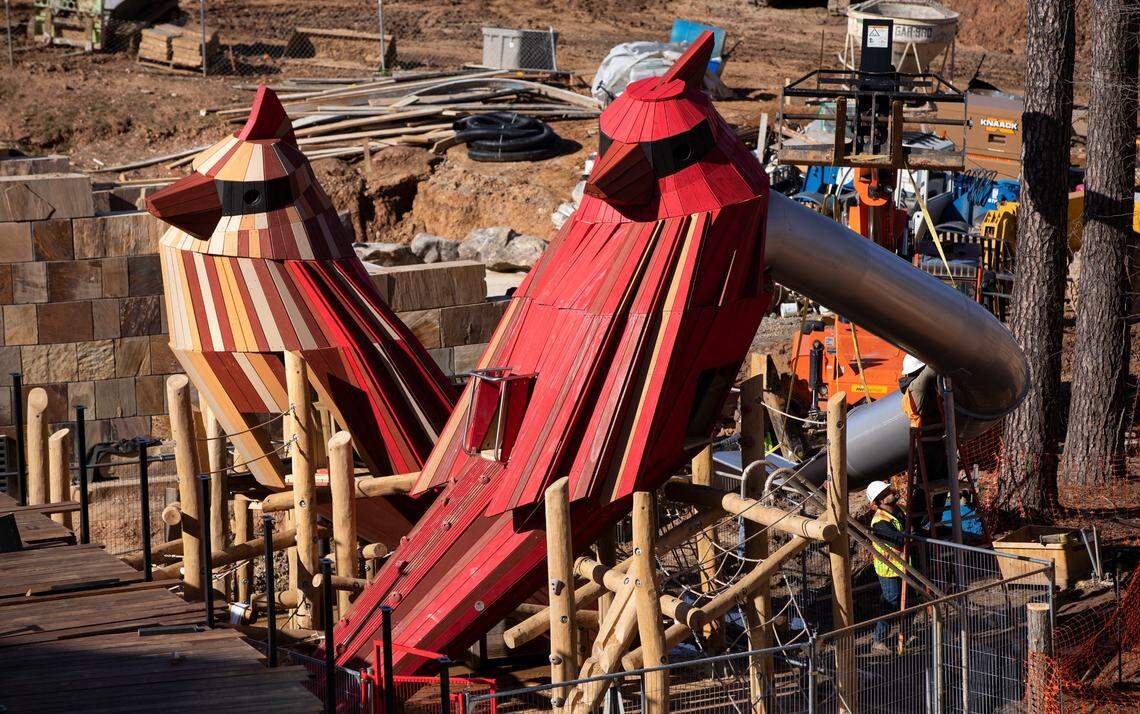Workers continue to assemble the apparatus surrounding two large sculptures of a male and female cardinal at Cary’s Downtown Park. They sculptures are located in a nature-based children’s play area called “The Nest.” Children will be able to climb inside and look out through their eyes, allowing an overview of the park.