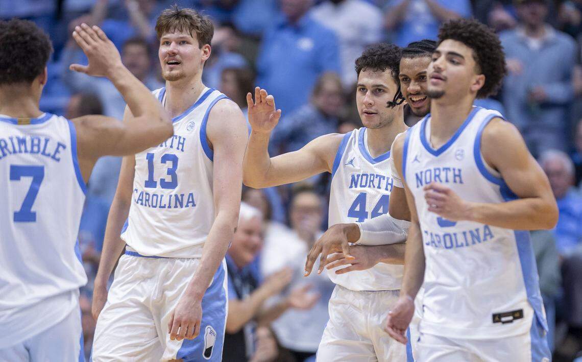 North Carolina guard Luka Bogavac (44) is surrounded by teammates after sinking a key three-point basket to give the Tar Heels a 59-53 lead in the second half against Clemson on Tuesday, March 3, 2026 at the Smith Center in Chapel Hill, N.C. Bogavac lead the Tar Heels with 20 points in their 67-63 victory. 