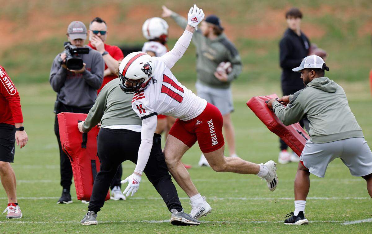 N.C. State linebacker Payton Wilson (11) runs drills during the Wolfpack’s first spring practice in Raleigh, N.C., Wednesday, March 1, 2023.
