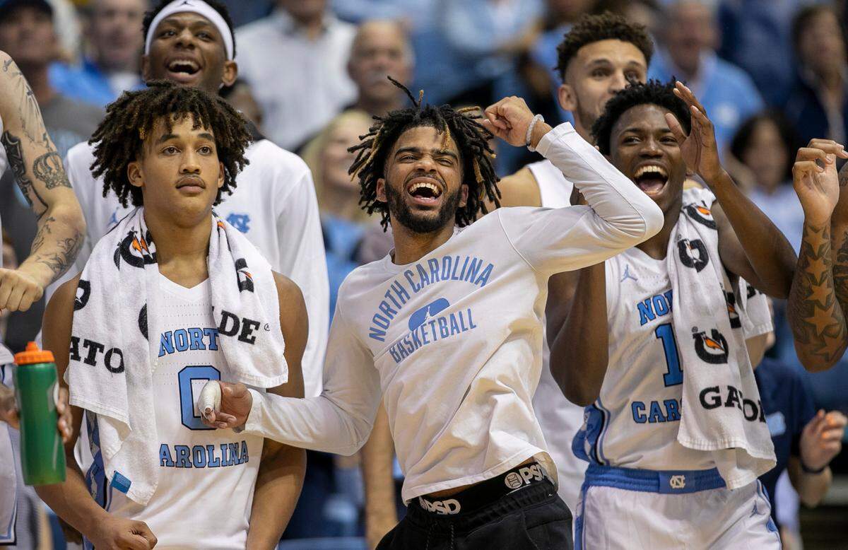 North Carolina’s R.J. Davis, center, reacts with his teammates after a free-throw by reserve player Rob Landry (15) to give the Tar Heels’ a 101-40 lead with 21 second to play against Johnson C. Smith on Friday, October 28, 2022 at the Smith Center in Chapel Hill, N.C.
