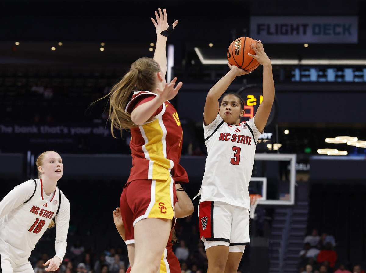 N.C. State’s Zamareya Jones shoots over Southern California’s Gerda Raulusaityte during the second half of the Wolfpack’s 69-68 loss in the Ally Tipoff game on Sunday, Nov. 9, 2025, at Spectrum Center in Charlotte, N.C.