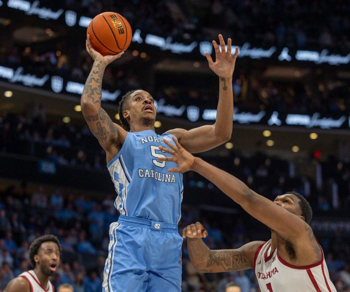 North Carolina’s Armando Bacot (5) puts up a shot over Oklahoma’s John Hugley IV (1) in the first half on Wednesday, December 20, 2023 at the Spectrum Center in Charlotte, N.C.
