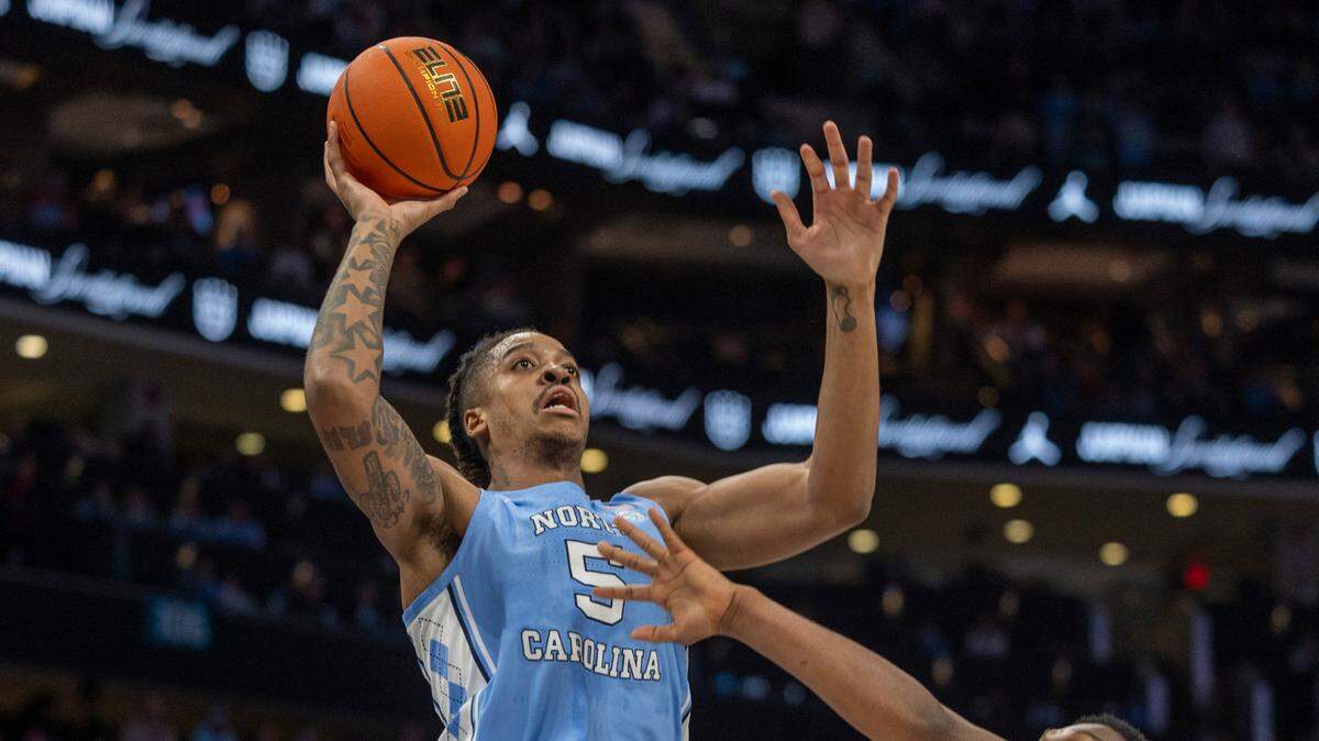 North Carolina’s Armando Bacot (5) puts up a shot over Oklahoma’s John Hugley IV (1) in the first half on Wednesday, December 20, 2023 at the Spectrum Center in Charlotte, N.C.
