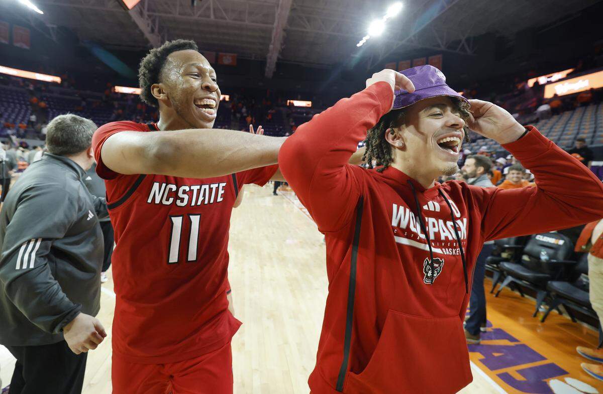 N.C. State's Quadir Copeland (11) celebrates with  Jordan Snell (0) after N.C. State’s 80-76 overtime victory over Clemson at Littlejohn Coliseum in Clemson, S.C., Tuesday, Jan. 20, 2026.