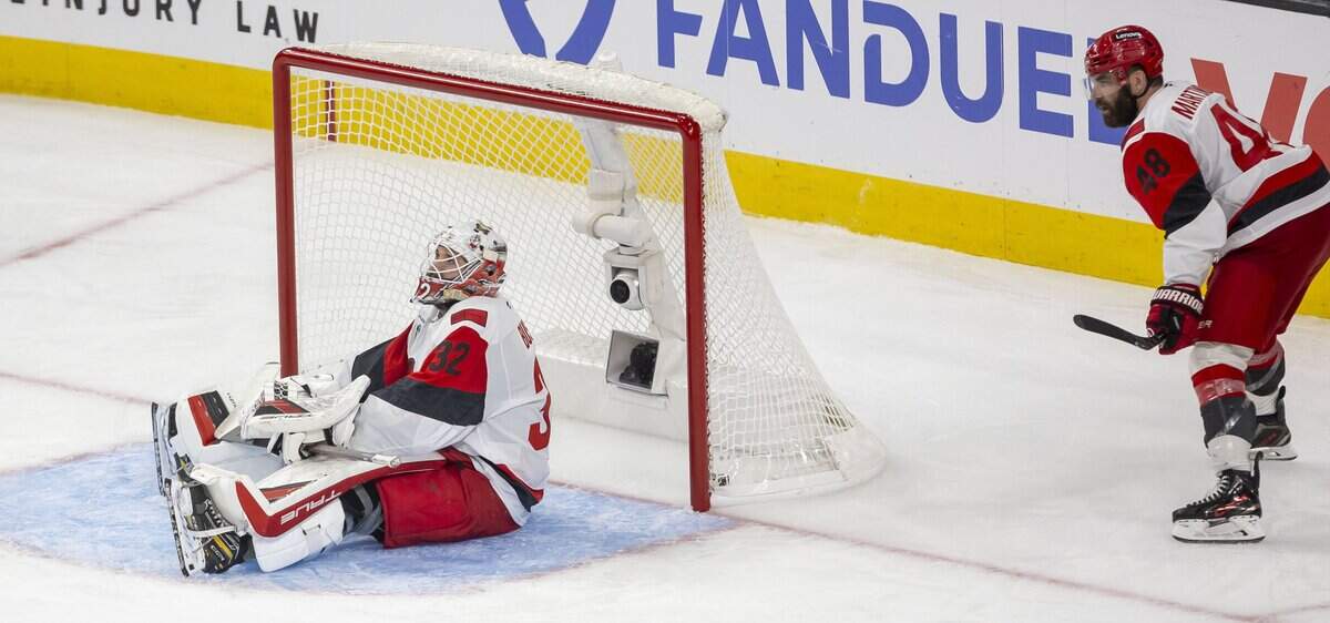 Carolina Hurricanes goalie Brandon Bussi (32) and left wing Jordan Martinook (48) react after a 5-4 double overtime loss to Vegas in Game 3 of the Stanley Cup Final, on Saturday, June 6, 2026 at T-Mobile Arena in Las Vegas, NV.
