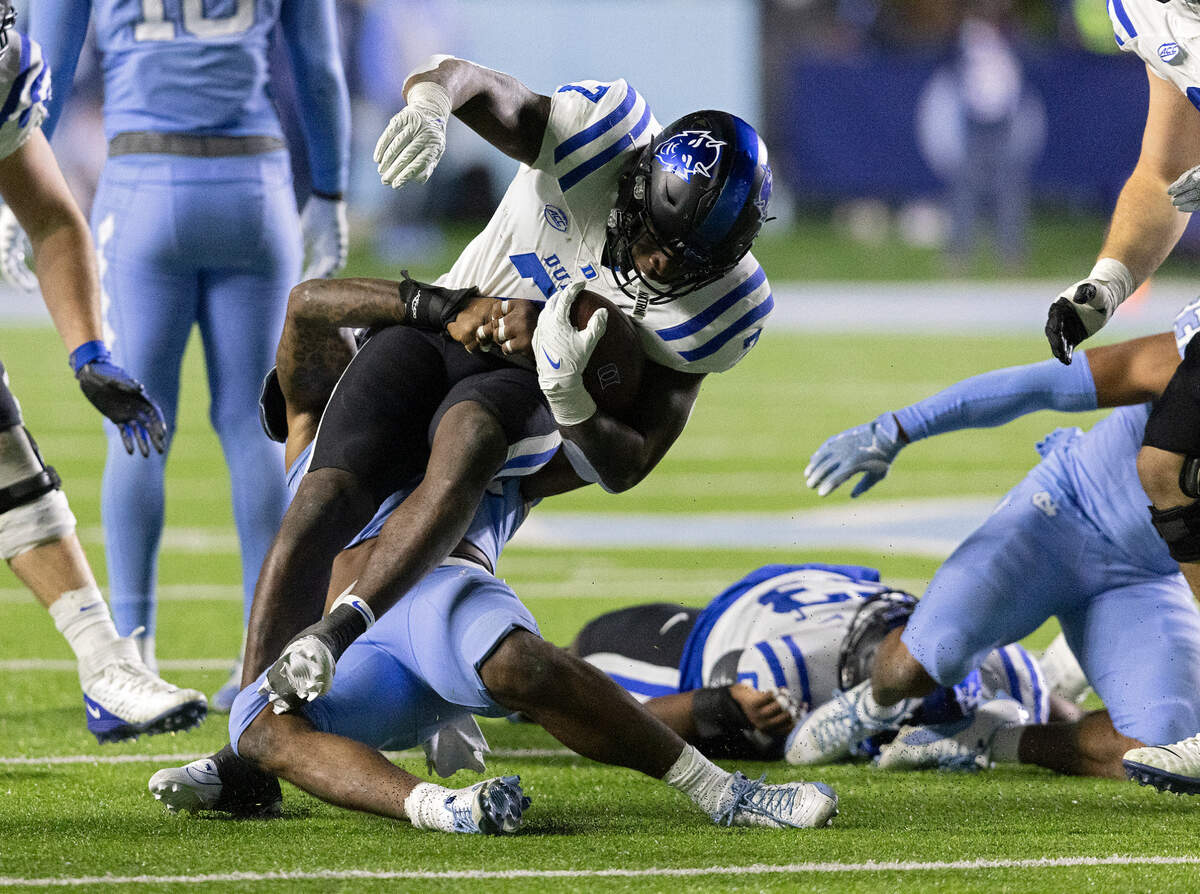 Duke’s Jordan Waters is tackled by North Carolina’s Power Echols during the second half of the Blue Devils 47-45 loss on Saturday, Nov. 11, 2023, at Kenan Stadium in Chapel Hill, N.C.