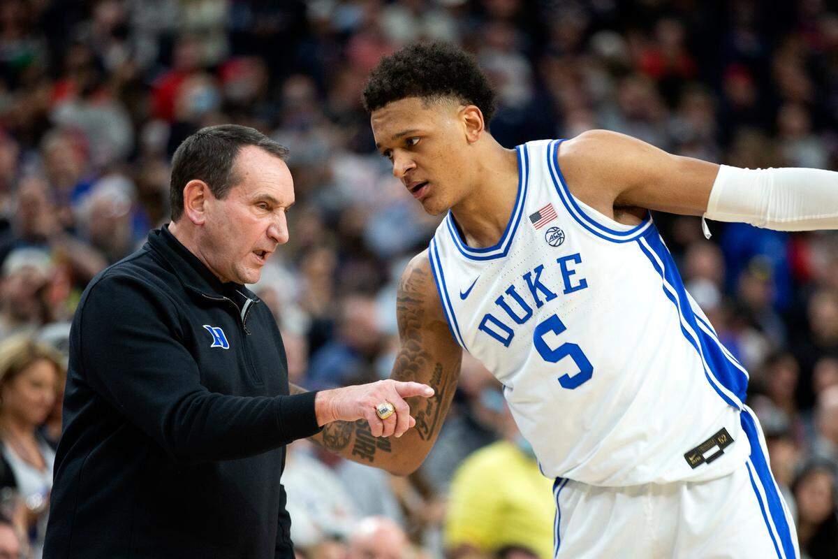 Duke coach Mike Krzyzewski talks to forward Paolo Banchero during the second half of the team’s NCAA college basketball game against Gonzaga on Friday, Nov. 26, 2021, in Las Vegas. 