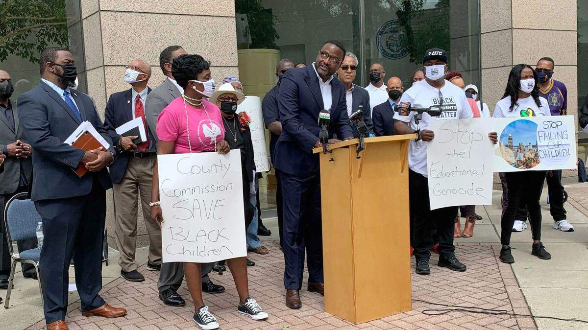 Local Black clergy leaders gather on Monday, May 10, 2021 in Charlotte, N.C., in support of a county proposal to withhold some school funding until progress is made on student performance, especially among Black youths.