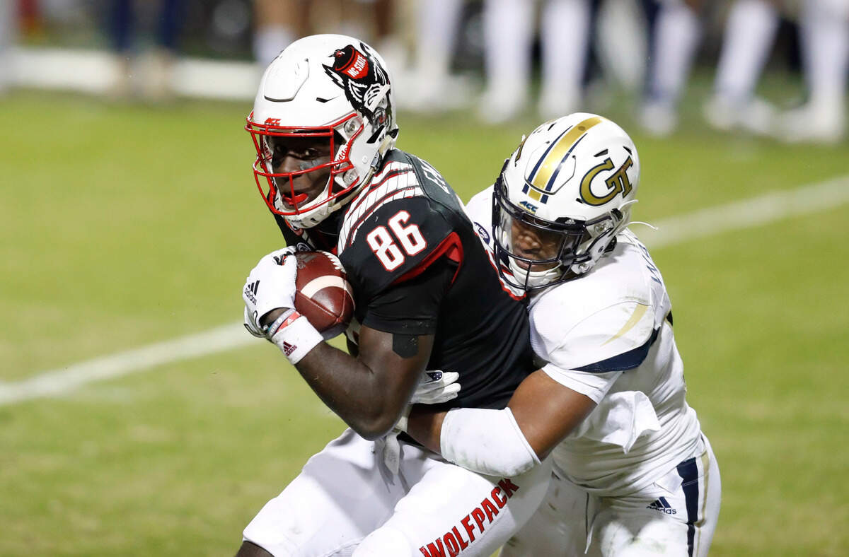 N.C. State wide receiver Emeka Emezie (86) pulls in a reception as Georgia Tech defensive back Wesley Walker (39) defends during the second half of N.C. State’s 23-13 victory over Georgia Tech at Carter-Finley Stadium in Raleigh, N.C., Saturday, Dec. 5, 2020.