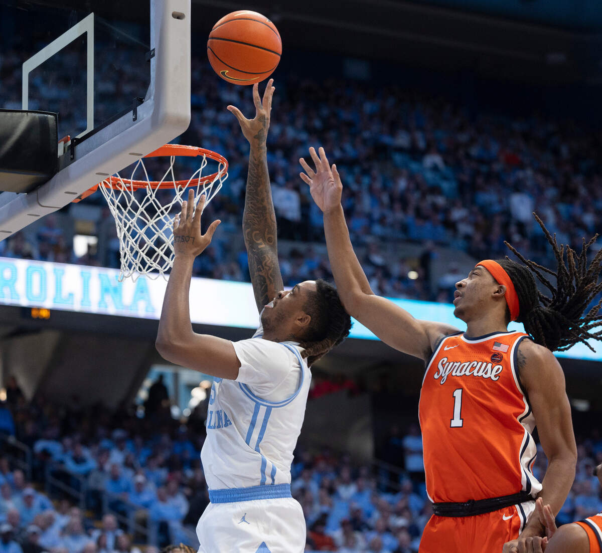 North Carolina’s Armando Bacot (5) puts up a shot against Syracuse’s Maliq Brown(1) in the second half on Saturday, January 13, 204 at the Smith Center in Chapel Hill, N.C.