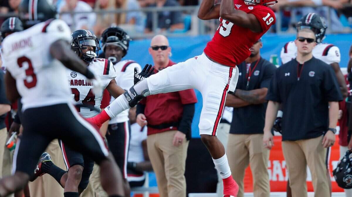 N.C. State wide receiver C.J. Riley (19) pulls in a reception during the second half of South Carolina’s 35-28 victory over N.C. State in the Belk College Kickoff at Bank of America Stadium in Charlotte, N.C., Saturday, Sept. 2, 2017.