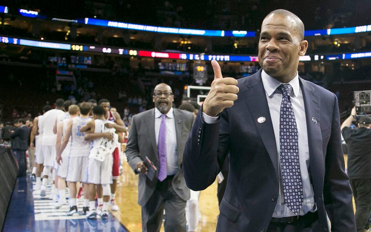North Carolina assistant coach Hubert Davis gives a thumbs up to fans as he leaves the court following the Tar Heels’ 101-86 victory over Indiana on Friday, March 25, 2016 in the NCAA East Regional semi-finals at the Wells Fargo Center in Philadelphia, Pa.