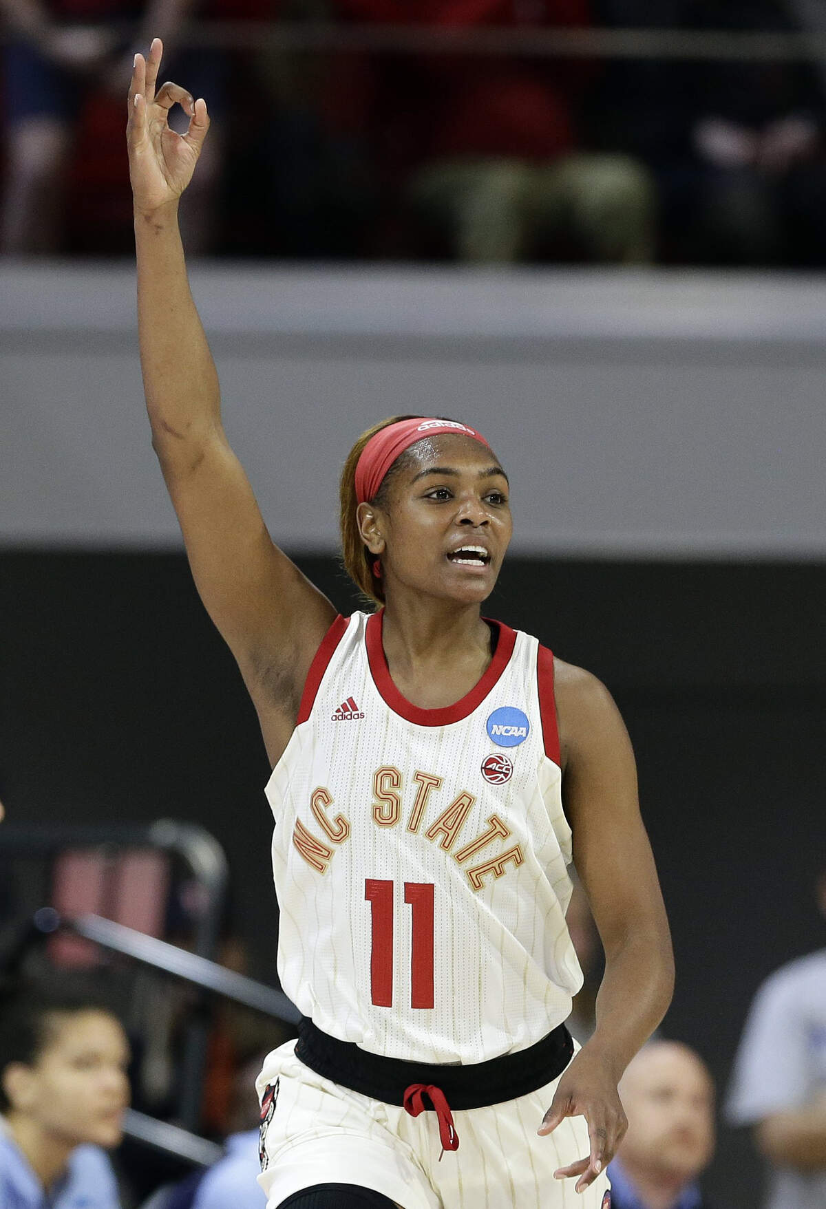 North Carolina State’s Kiara Leslie (11) reacts following a 3-point basket against Maine during the first half of a first-round game in the NCAA women’s college basketball tournament in Raleigh, N.C., Saturday, March 23, 2019.