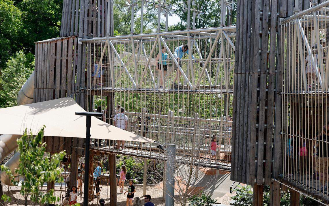 People enjoy the bridges in slide valley at Gipson Play Plaza at Dix Park during a preview day Saturday, May 24, 2025. The park will officially open with a grand opening celebration on June 6th, 7th and 8th.