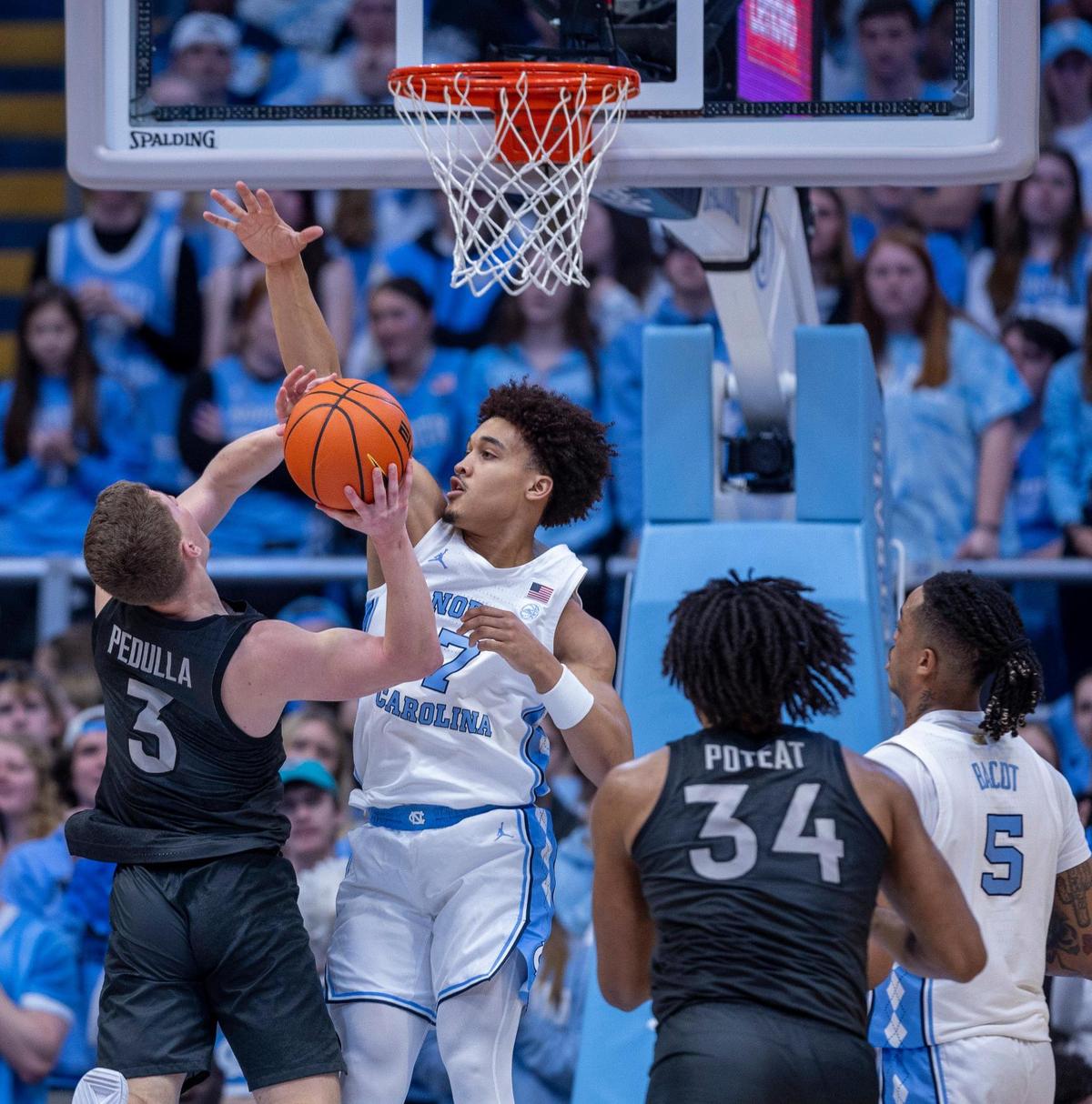 North Carolina’s Seth Trimble (7) defends Virginia Tech’s Sean Pedulla (3) during the first half on Saturday, February 17, 2023 at the Smith Center in Chapel Hill, N.C.