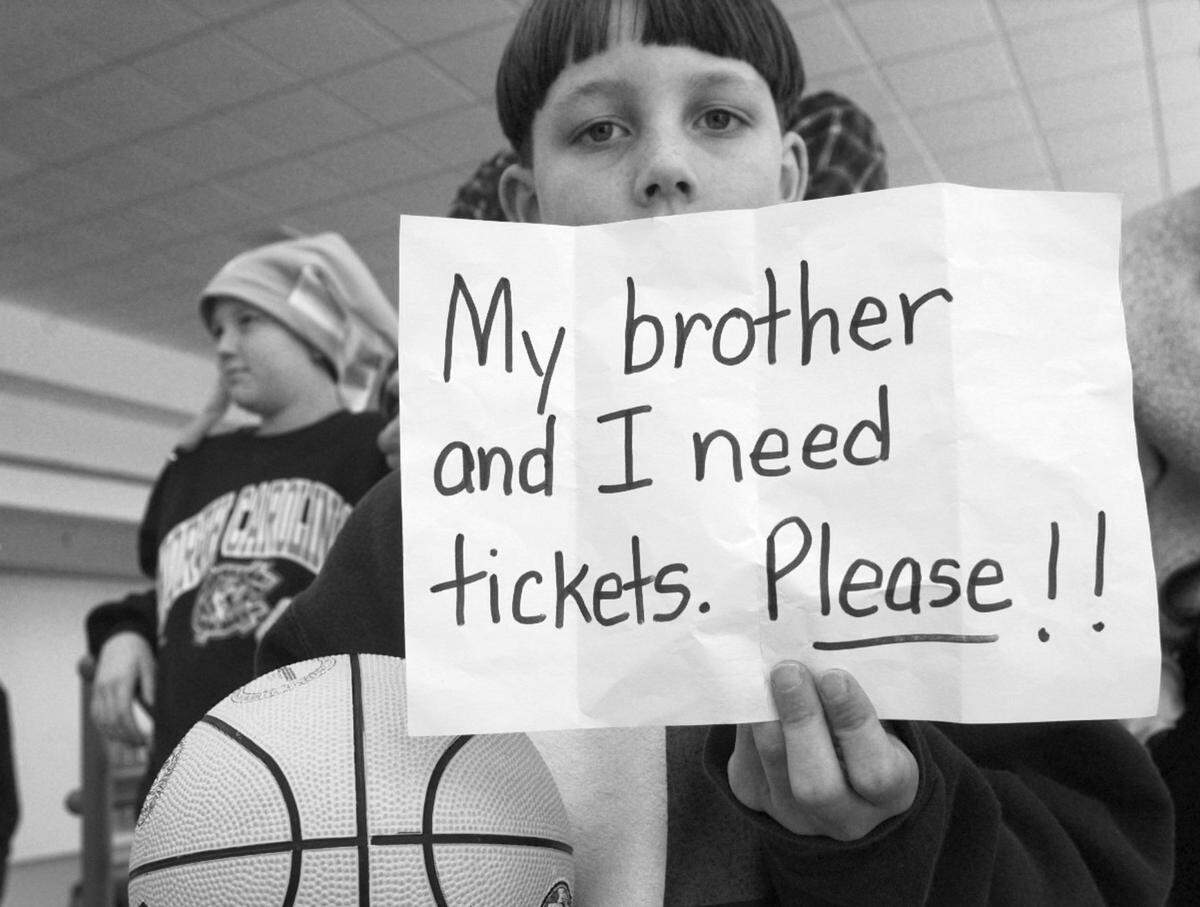 Young fans try to score tickets to the Saturday session of the ACC Tournament in Greensboro in 1997.