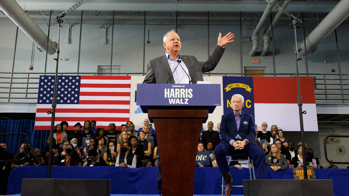 Democratic vice presidential candidate and Minnesota Gov. Tim Walz speaks during a rally at the Community Family Life & Recreation Center at Lyon Park as former President Bill Clinton listens on Thursday, Oct. 17, 2024, in Durham, N.C.