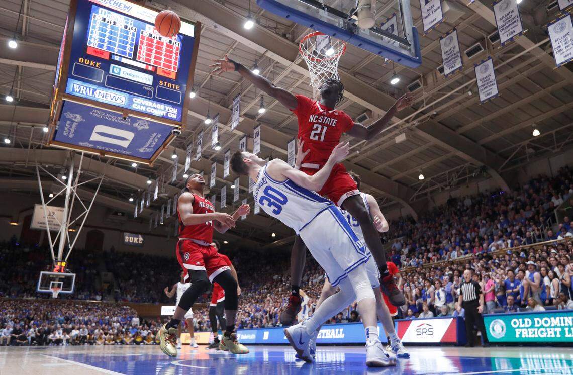 N.C. State’s Ebenezer Dowuona (21) blocks the shot by Duke’s Kyle Filipowski (30) during Duke’s 71-67 victory over N.C. State at Cameron Indoor Stadium in Durham, N.C., Tuesday, Feb. 28, 2023.