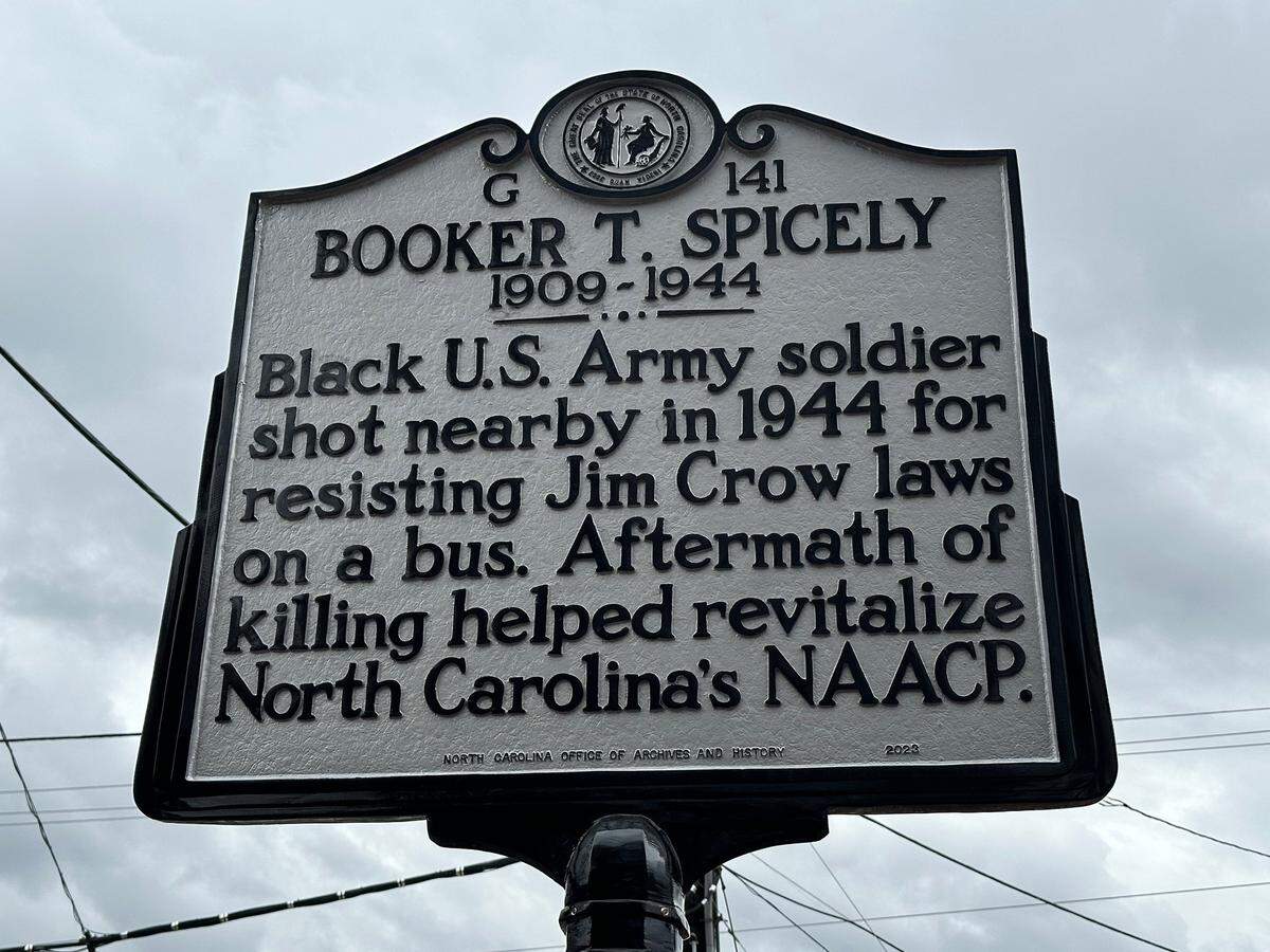 A state highway historical marker, unveiled Dec. 1, 2023, in Durham, honors a Black World War II soldier Booker Spicely who was shot and killed by a bus driver after initially resisting a demand that he move to the back of the bus.