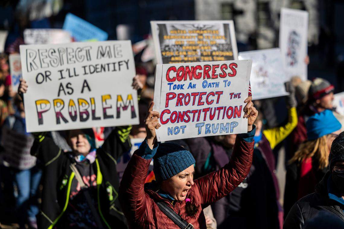 Hundreds of demonstrators march around the perimeter at the North Carolina State Capitol on Monday, Feb. 17, 2025 during a rally billed as a “We The People Protest” organized by Fifty Fifty One.