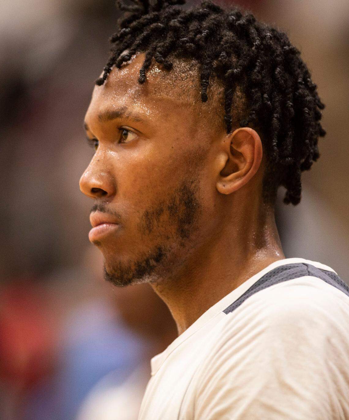 Kinston High School senior and varsity basketball player Jeremy Dixon looks out on the court during a state playoff game at the team’s home gym in Kinston, N.C. on Feb. 24, 2022.