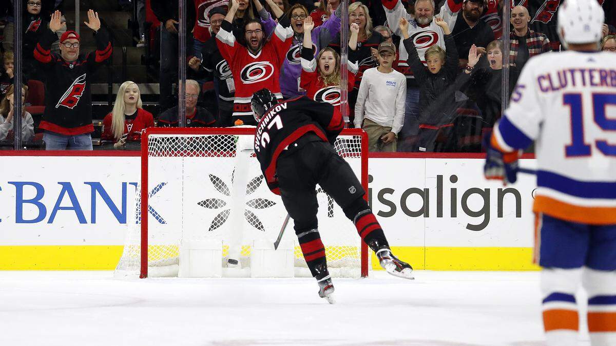 Carolina Hurricanes’ Andrei Svechnikov (37), of Russia, puts the puck in the empty net against the New York Islanders during the third period of an NHL hockey game in Raleigh, N.C., Friday, Oct. 11, 2019. (AP Photo/Karl B DeBlaker)