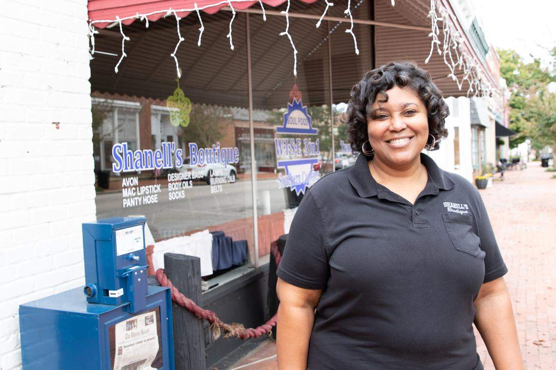 Ebony Talley-Brame stands in front of her store, 3-in-1. The store is a soul food restaurant, a boutique and a transportation service. She opened the store in August of 2017.