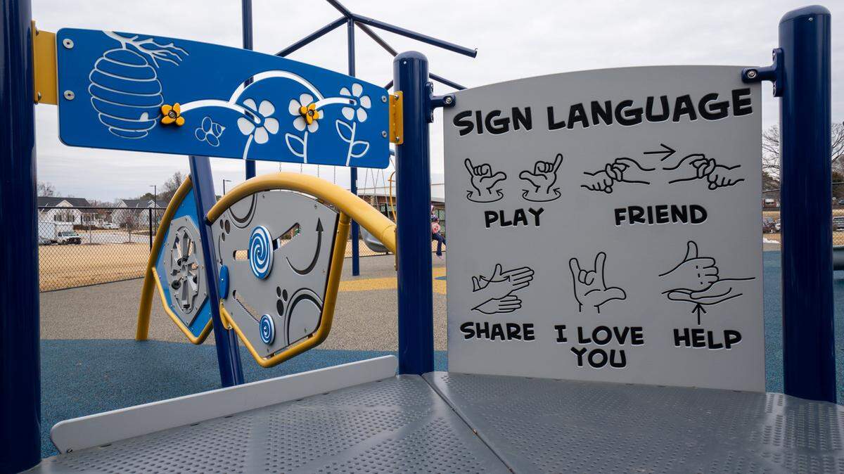 A new accessible playground, featuring a sign language board with the alphabet and common phrases, opened in February 2026 at Garner Recreation Center.