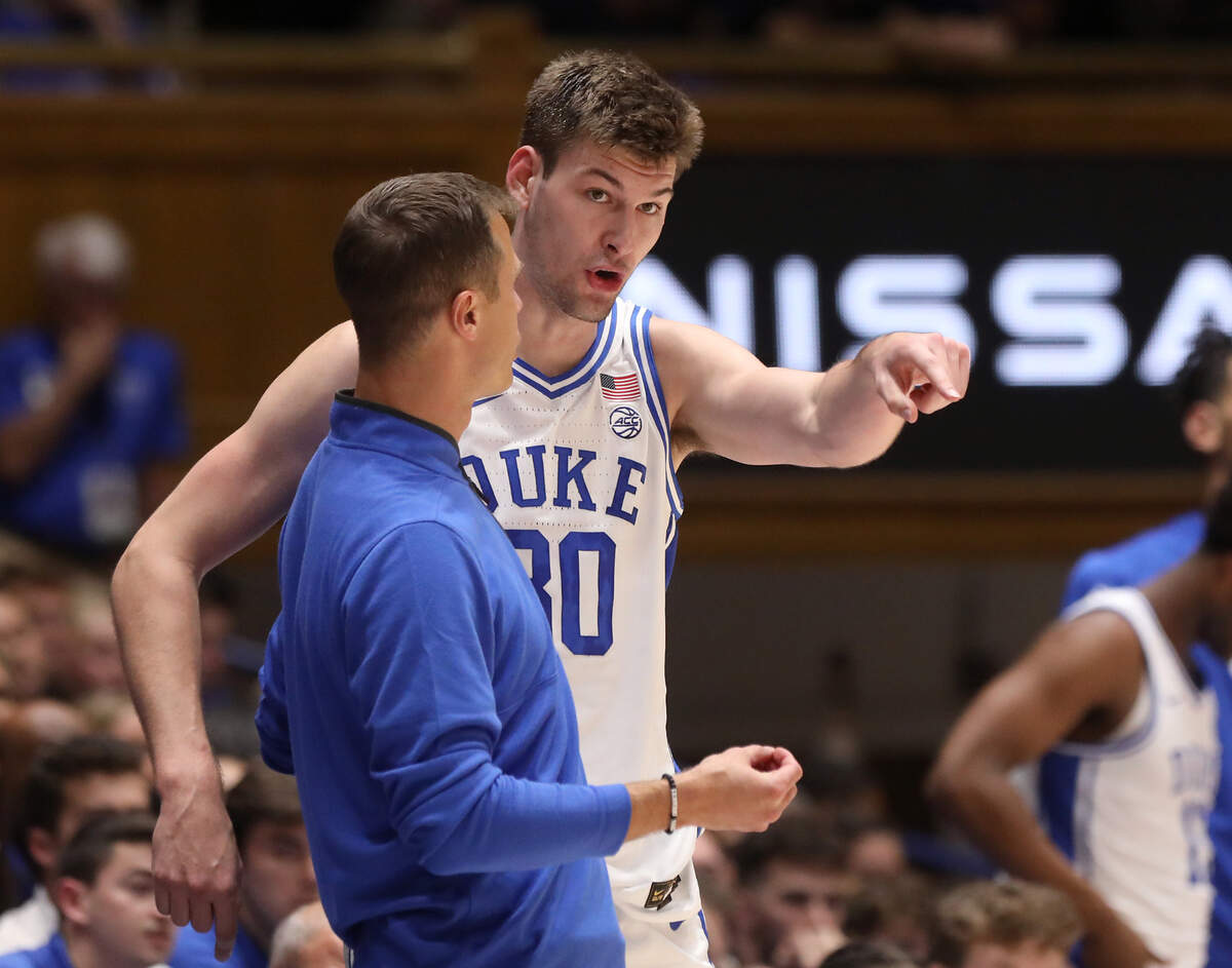 Duke’s Kyle Filipowski talks with head coach Jon Scheyer during the first half of the Blue Devils’ 109-64 exhibition win over UNC Pembroke on Wednesday, Nov. 1, 2023, at Cameron Indoor Stadium in Durham, N.C.
