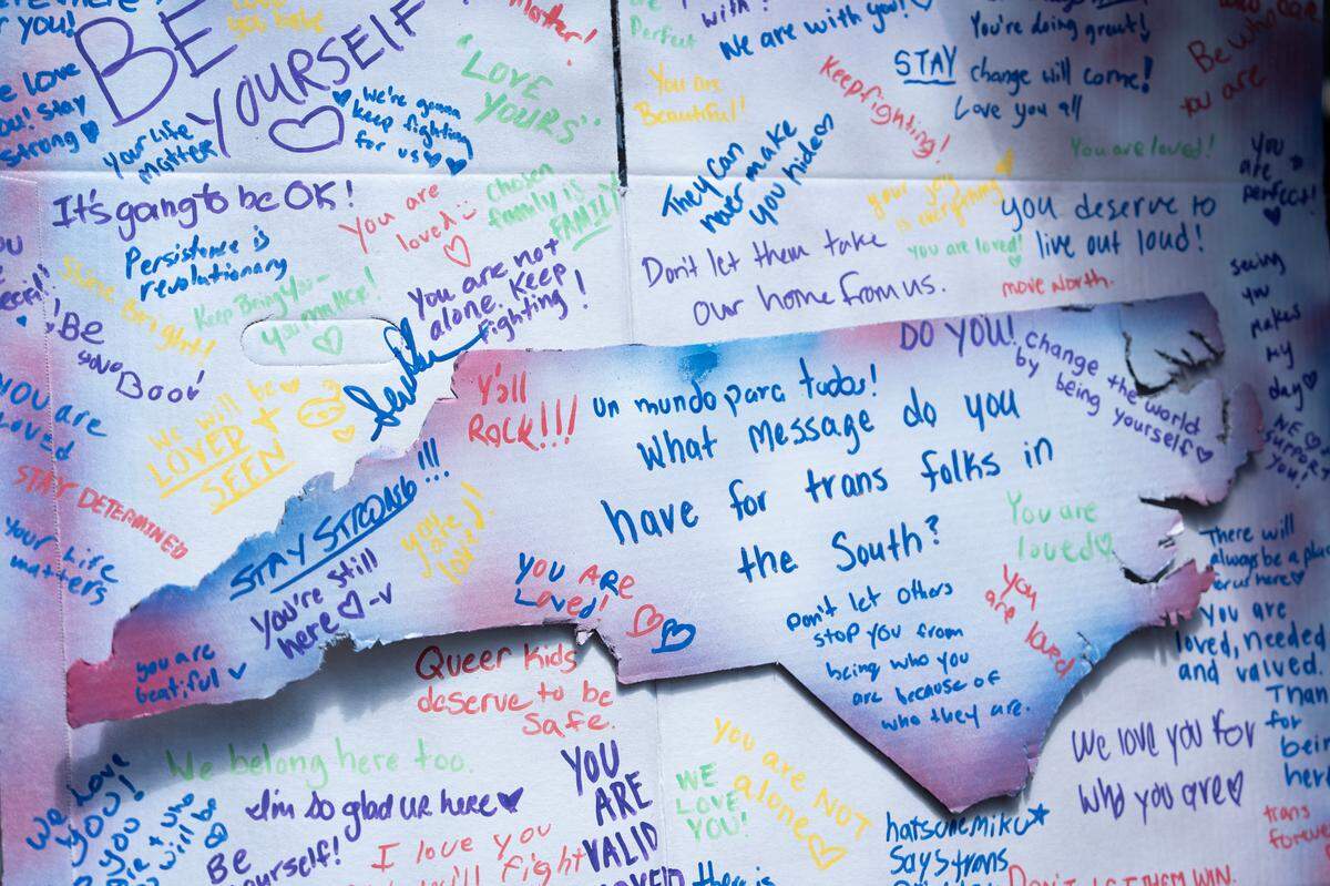 Messages are written on a board to uplift the LGBTQ community at the Out! Raleigh Pride festival in downtown Raleigh on Saturday, June 21, 2025.