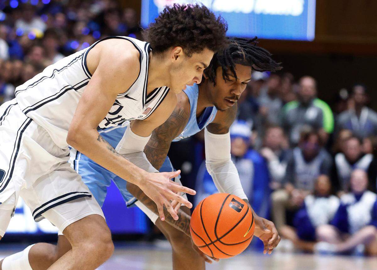 Duke’s Tyrese Proctor (5) steals the ball from North Carolina’s Caleb Love (2) during the first half of Duke’s game against UNC at Cameron Indoor Stadium in Durham, N.C., Saturday, Feb. 4, 2023.