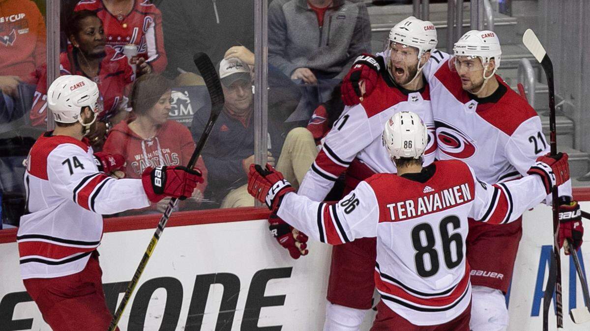 Carolina Hurricanes’ Jordan Staal (11) is surrounded by teammates after scoring in the third period to tie the Washington Capitals during Game 7 of their first round Stanley Cup series on Wednesday, April 24, 2019 at Capital One Arena in Washington, D.C.