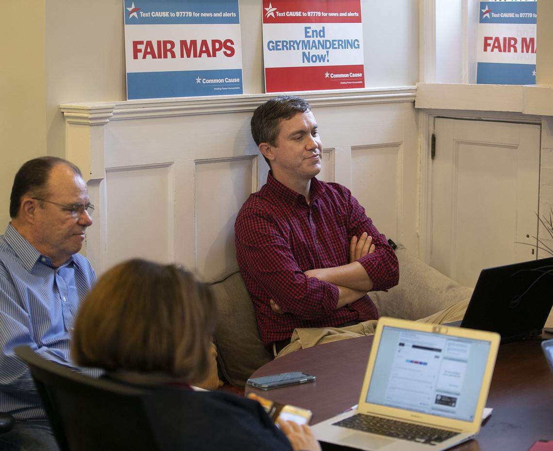 Common Cause of North Carolina staff member Brent Laurenz, right, reacts after reading the Supreme Court’s decision on gerrymandering at the Common Cause office on Glenwood Avenue in Raleigh, N.C. on Thursday, June 27, 2019