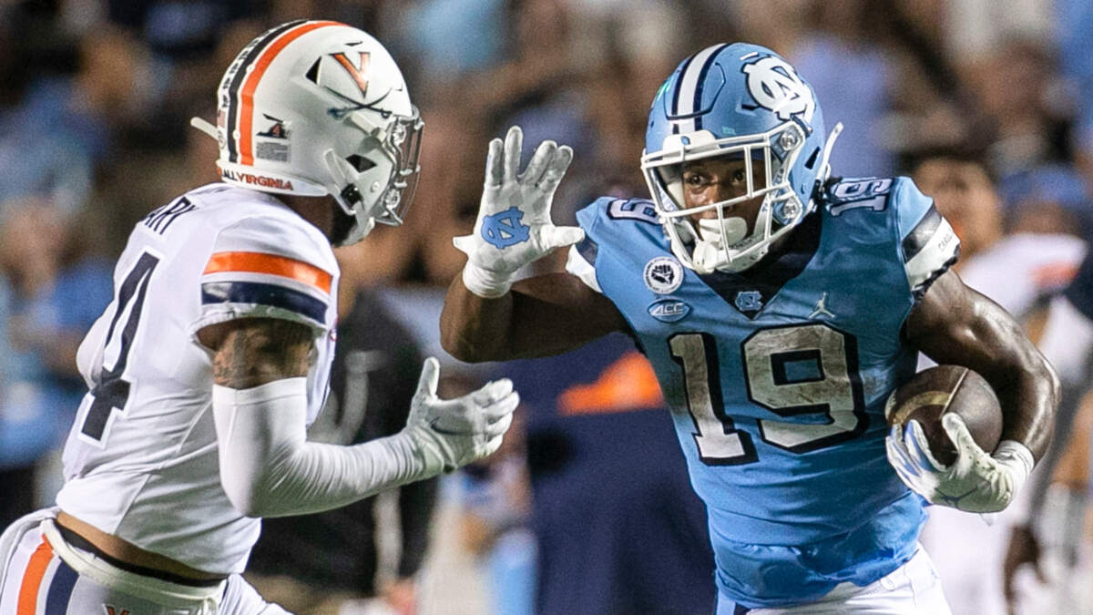 Virginia’s Elliott Brown (4) works to slow North Carolina’s Ty Chandler (19) on a 21-yard run in the third quarter on Saturday, September 18, 2021 at Kenan Stadium in Chapel Hill, N.C. Chandler rushed for 198 yards and two touchdowns.
