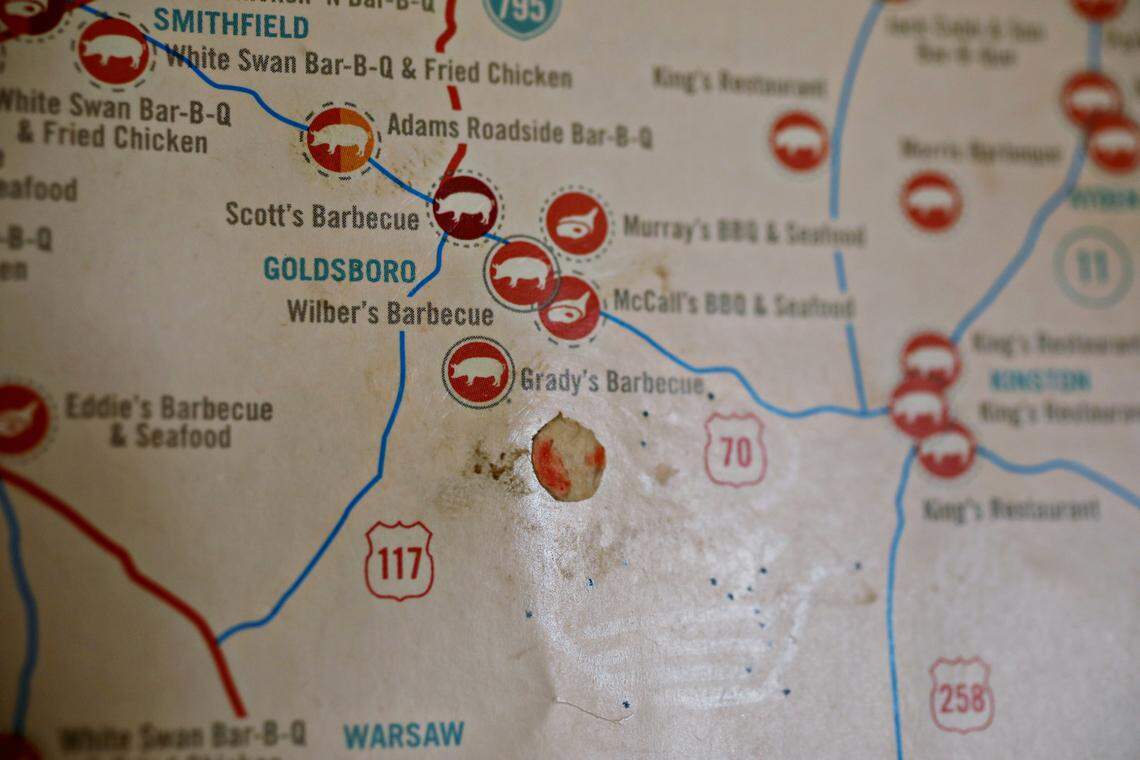 A worn sticker marks GradyÕs Barbecue on the ÒGreat N.C. BBQ MapÓ hanging in the dining room of GradyÕs Barbecue in Dudley, NC.