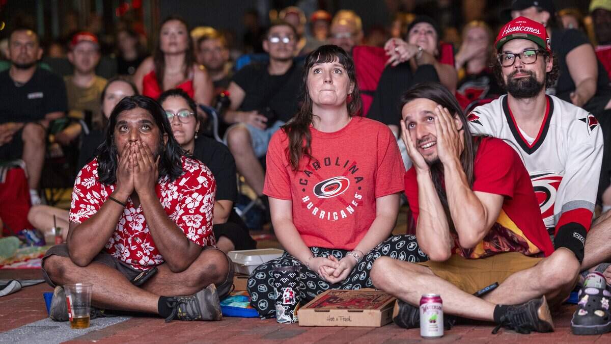 Carolina Hurricanes fans react during a Stanley Cup Final watch party in Raleigh's Smoky Hollow district on Tuesday, June 9, 2026, as the Hurricanes play the Vegas Golden Knights in Game 4 of the Stanley Cup Final.