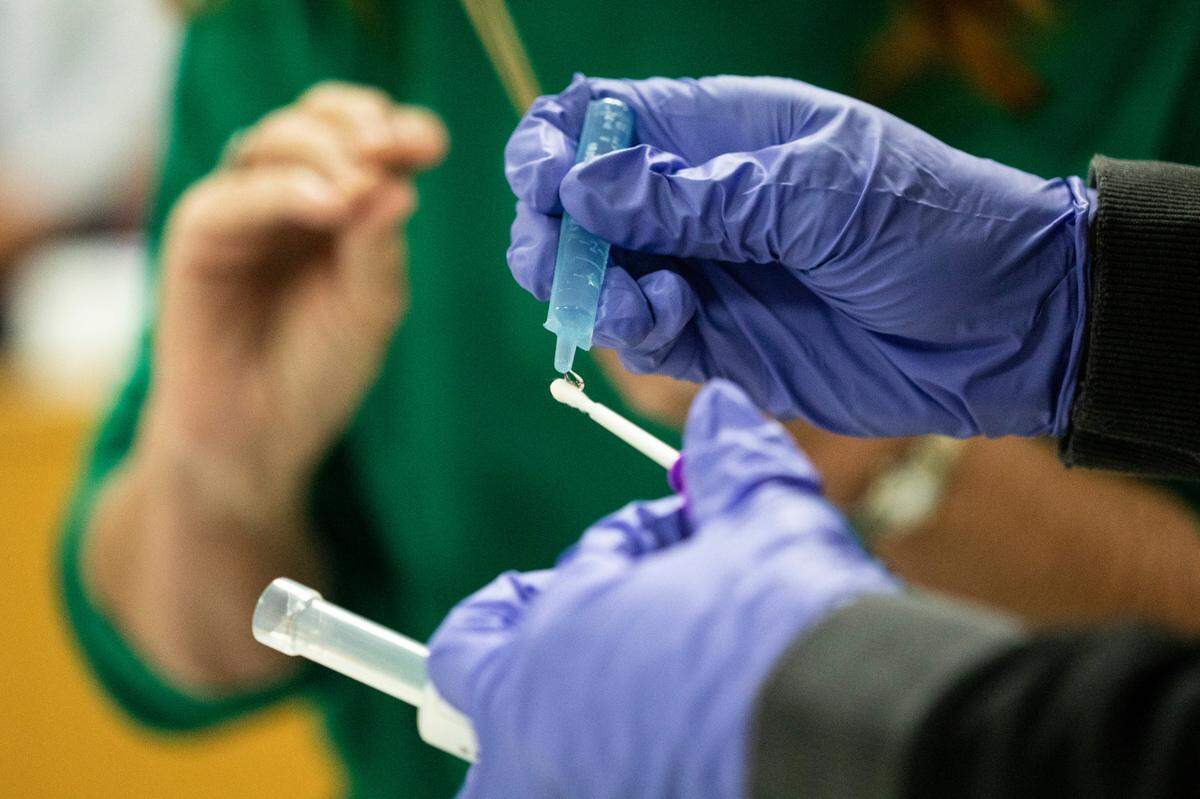A student in Wake Tech Community College’s Investigative Principles course prepares a DNA sample for analysis by the ANDE Rapid DNA System machine, the only one in the state, at the school’s Public Safety Education Campus in Raleigh, N.C. on Tuesday, Nov. 2, 2021.