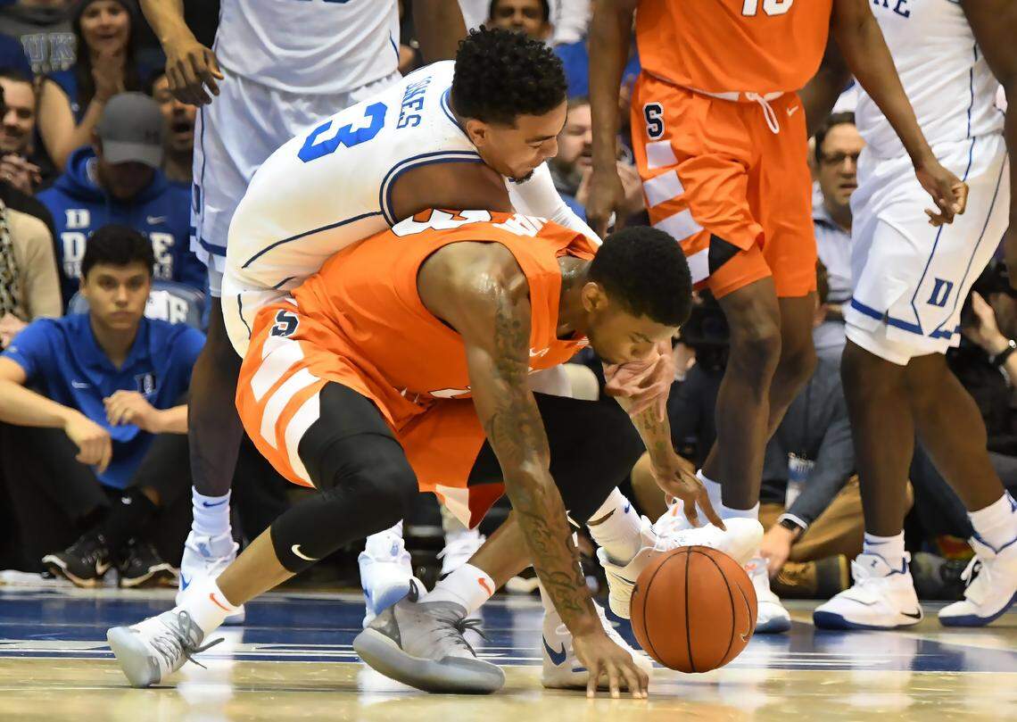 Duke guard Tre Jones (3) collides with Syracuse guard Frank Howard (23) and suffered a suffered an acromioclavicular (AC) joint separation and left the game in the first half of play. Syracuse upset the number 1 ranked Blue Devils 95-91 in overtime at Cameron Indoor Stadium In Durham, N.C. Monday, January 14, 2019.