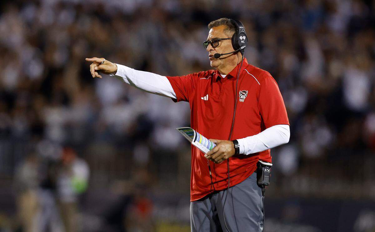 N.C. State offensive coordinator Robert Anae direct the offense during the second half of N.C. State’s 24-14 victory over UConn at Rentschler Field in East Hartford, Conn. Thursday, August 31, 2023.
