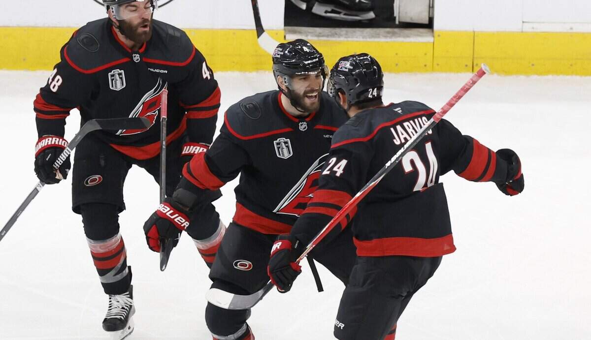 Carolina's Shayne Gostisbehere (center) celebrates with Seth Jarvis after he scored in overtime of the Hurricanes’ 4-3 victory over the Las Vegas Golden Knights in Game 2 of the Stanley Cup Final. Gostisbehere spent his first two years of high school at Marjory Stoneman Douglas in Parkland before moving to Connecticut.