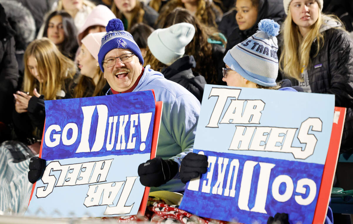 Nate Carmody and his daughter Brooke show their support for the teams during North Carolina’s 3-0 victory over Duke in the semifinals of the 2024 Women’s College Cup at WakeMed Soccer Park in Cary, N.C., Friday, Dec. 6, 2024. The two are graduates of the University of Virginia and live in Falls Church and came down to see the games.